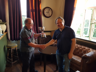 Per Saunders collecting from Geoff Gammon trophies on behalf of Aron.