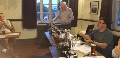 Ian Pickup working out what all the trophies are.