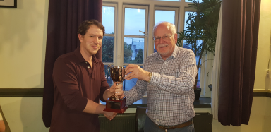Michael Meadows officially winning the trophy for the 2018 summer rapidplay.